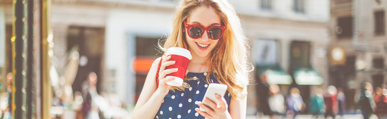 Young woman using phone in downtown area